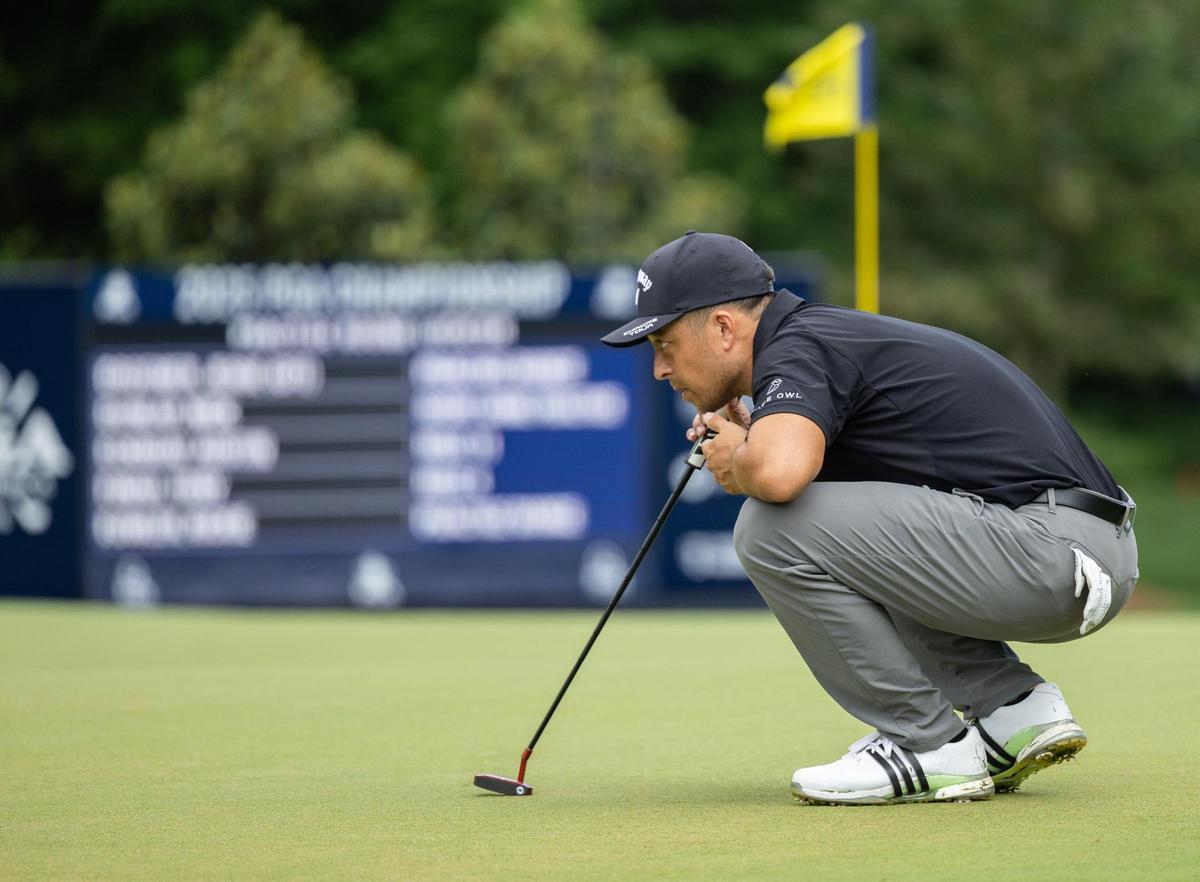 Xander Schauffele lines up a putt on the 12th hole during the second practice day at the 107th PGA Championship at Quail Hollow in Charlotte, N.C., on Wednesday, May 14, 2025.