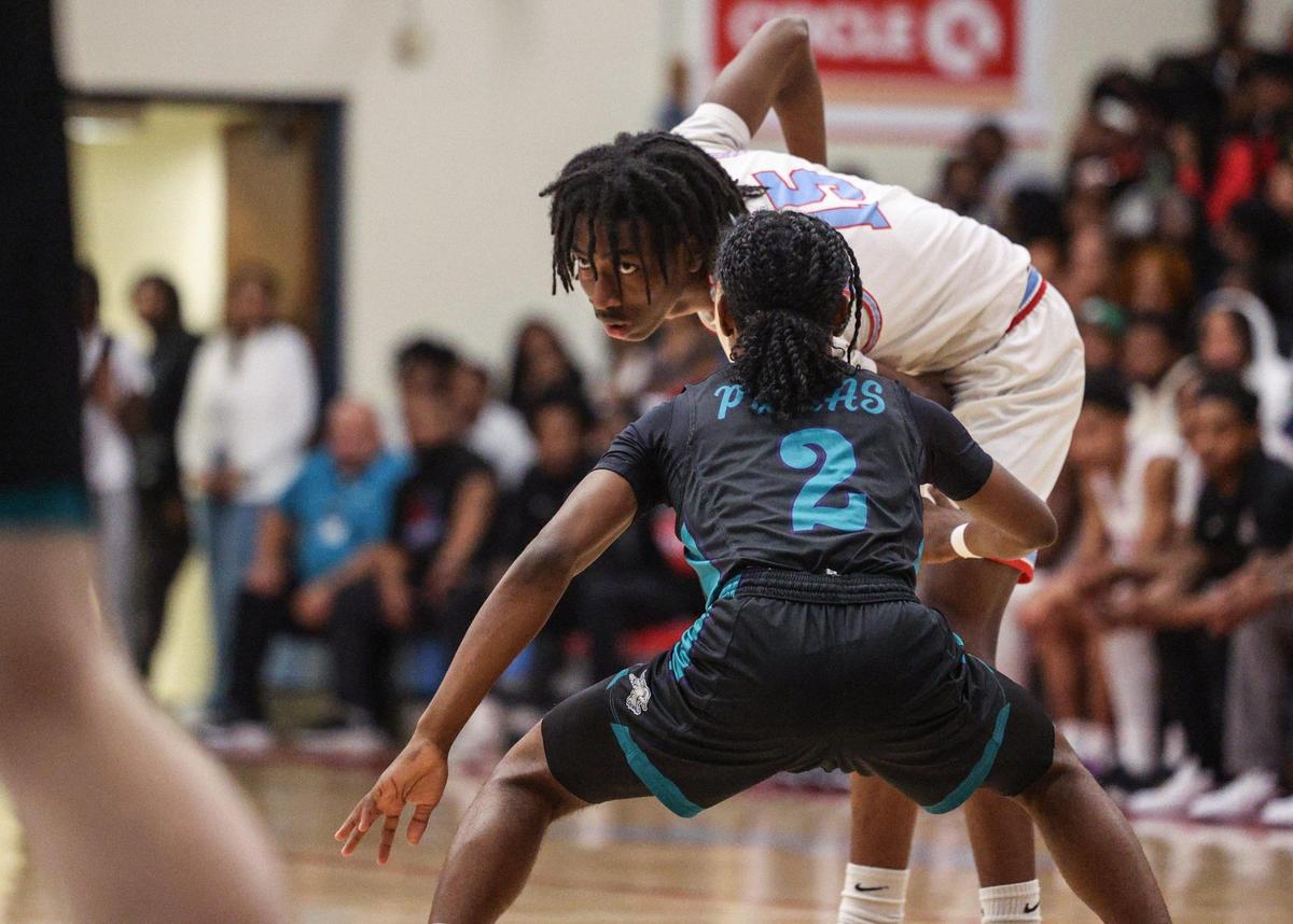Olympic’s Terrnance Southerland eyes the court for an open teammate during the game against Palisades at Olympic High School in Charlotte, NC on Tuesday, February 4, 2025.