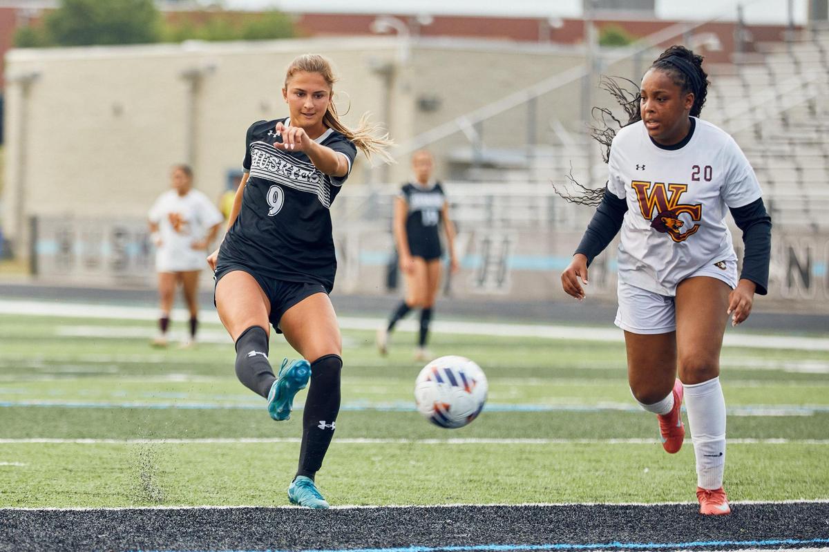 Hough Girl’s Soccer junior forward Ava Hauser rifles a shot past the West Charlotte defense on Senior Night. The Hough Huskies won 10-0 after a mercy rule following halftime.