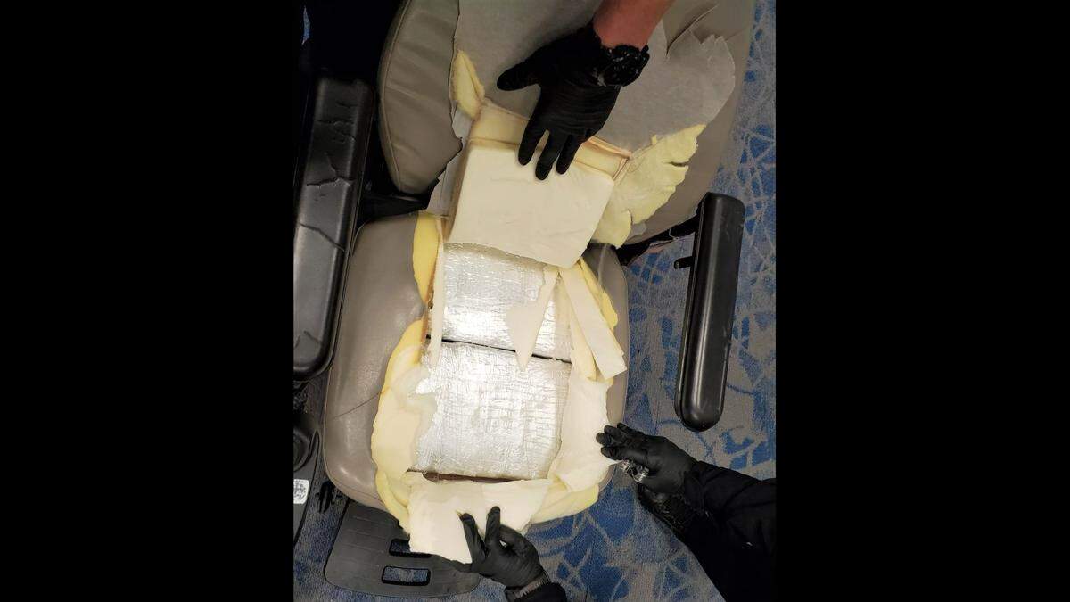 Authorities at Charlotte Douglas International Airport show how cocaine was hidden in a motorized wheelchair’s seat. About 11 kilograms, just over 24 pounds, of the drug were stuffed in the seat.