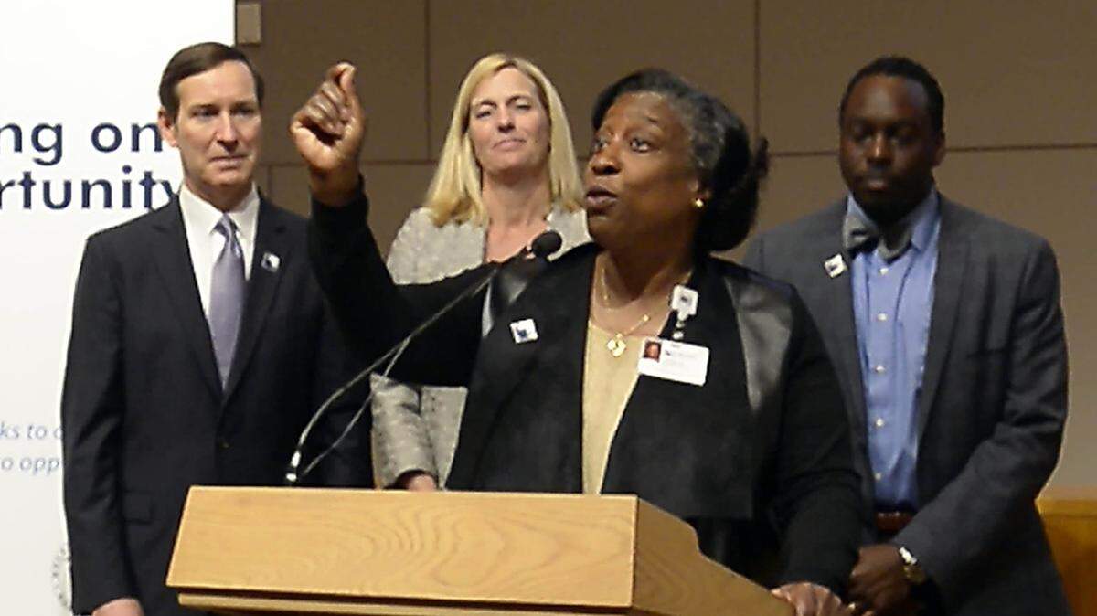 Dr. Ophelia Garmon-Brown unveils the Charlotte-Mecklenburg Opportunity Task Force report in March 2017. Visionary leaders and those grounded in reality need to work together to solve Charlotte's challenges.