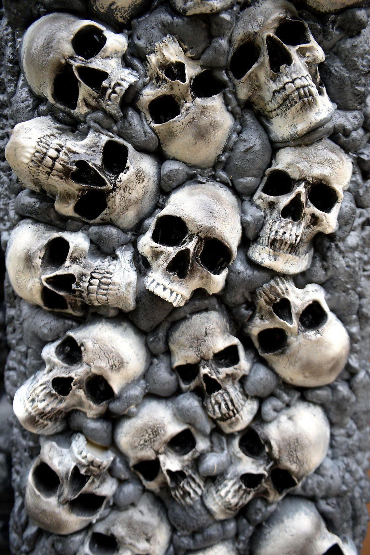 Kristen Johnson created this pillar of skulls to help decorate her and husband’s yard haunt in Elizabeth.