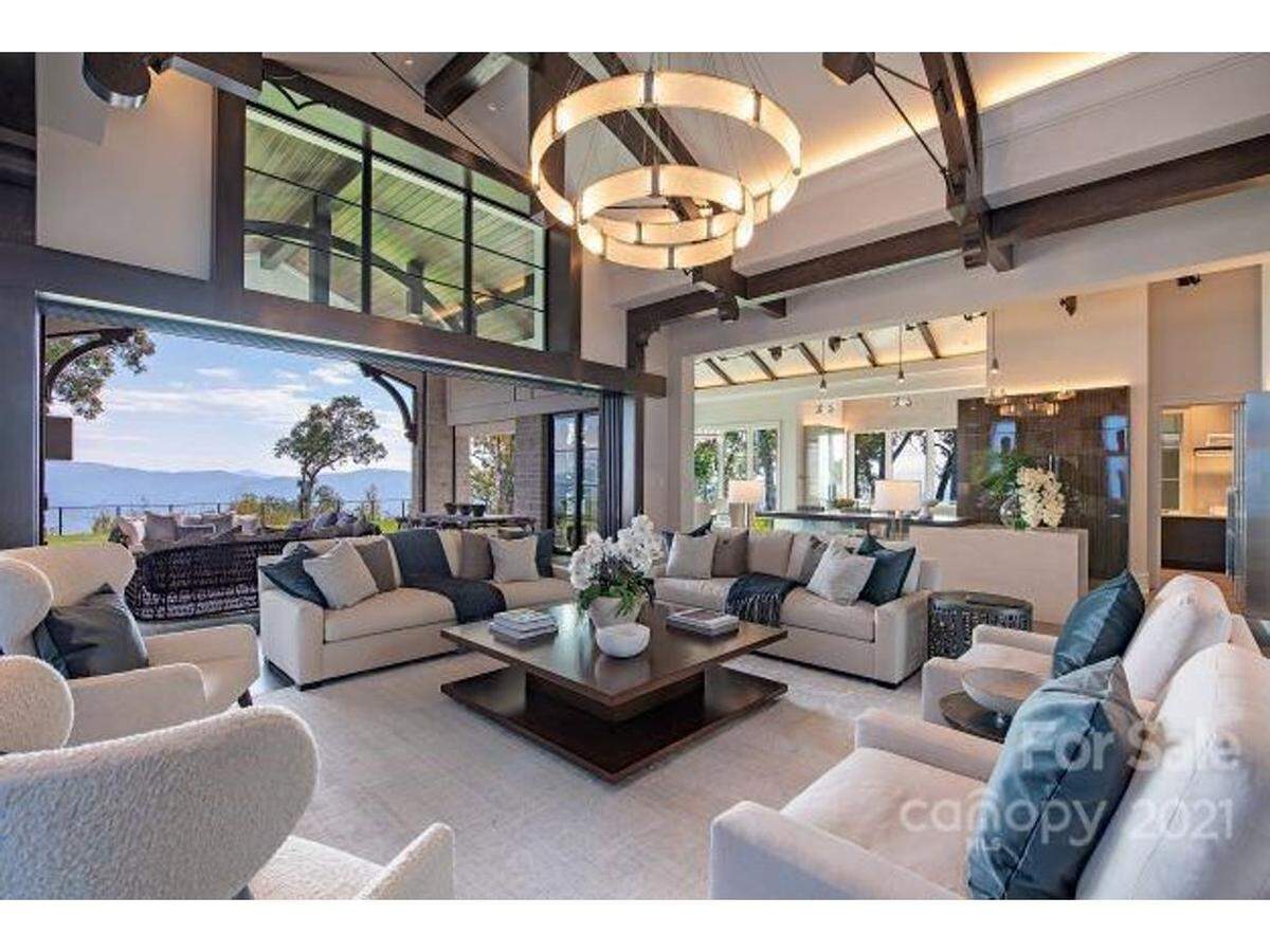 The home at 264 Skycliff Drive in the gated Wildcat Cliffs community in Asheville offers 360-degree mountain views.  