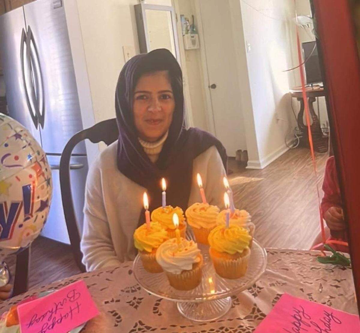 Nabila Rasoul, a recently resettled Afghan refugee, is shown in her Charlotte home in a photo taken by her husband on Valentine’s Day, Feb. 16, 2022. Rasoul and her volunteer helper, 75-year-old Enedina Fernandez, were killed the next day by a driver charged with driving while impaired, police said.