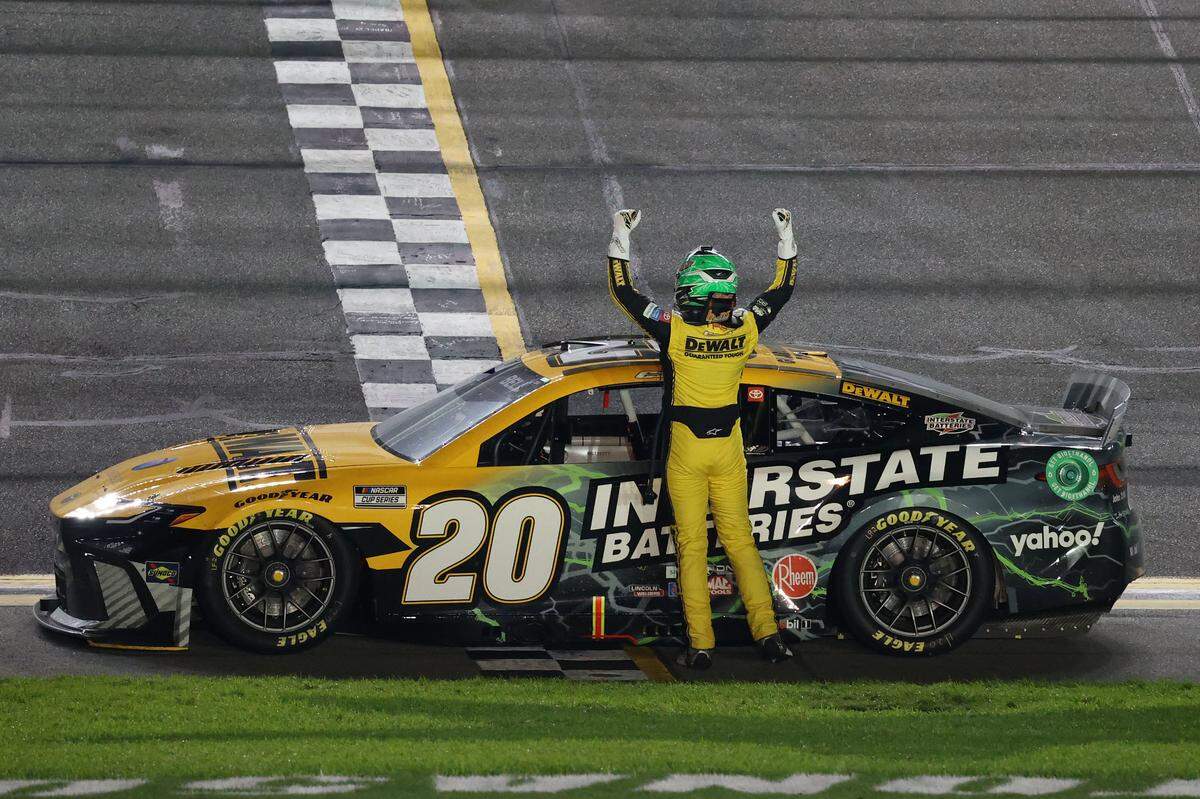 Feb 15, 2024; Daytona Beach, Florida, USA; NASCAR Cup Series driver Christopher Bell (20) reacts after winning the Bluegreen Vacations Duel 2 at Daytona International Speedway. Mandatory Credit: Peter Casey-USA TODAY Sports