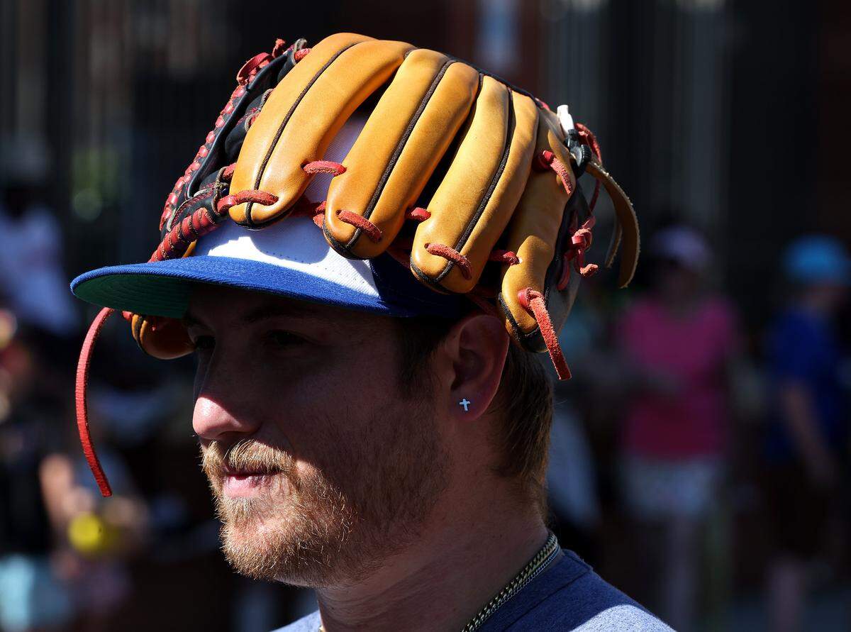 Damian Swanky of Waxhaw, NC found a comfortable way to carry his glove as he and his family enjoyed a meet and greet with members of the Texas Tailgaters and Firefighters outside Truist Field in Charlotte, NC on Thursday, June 4, 2026. Fans packed Truist Field for Banana Ball action between the Texas Tailgaters and Firefighters.