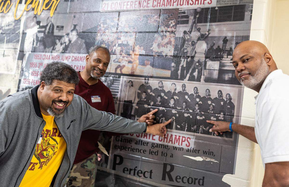 West Charlotte 1986 State Championship basketball players, Maurice Caldwell, from left, Duane Montgomery and Jules Springs pose for a portrait at West Charlotte High School in Charlotte, N.C., on Monday, March 9, 2026. 
