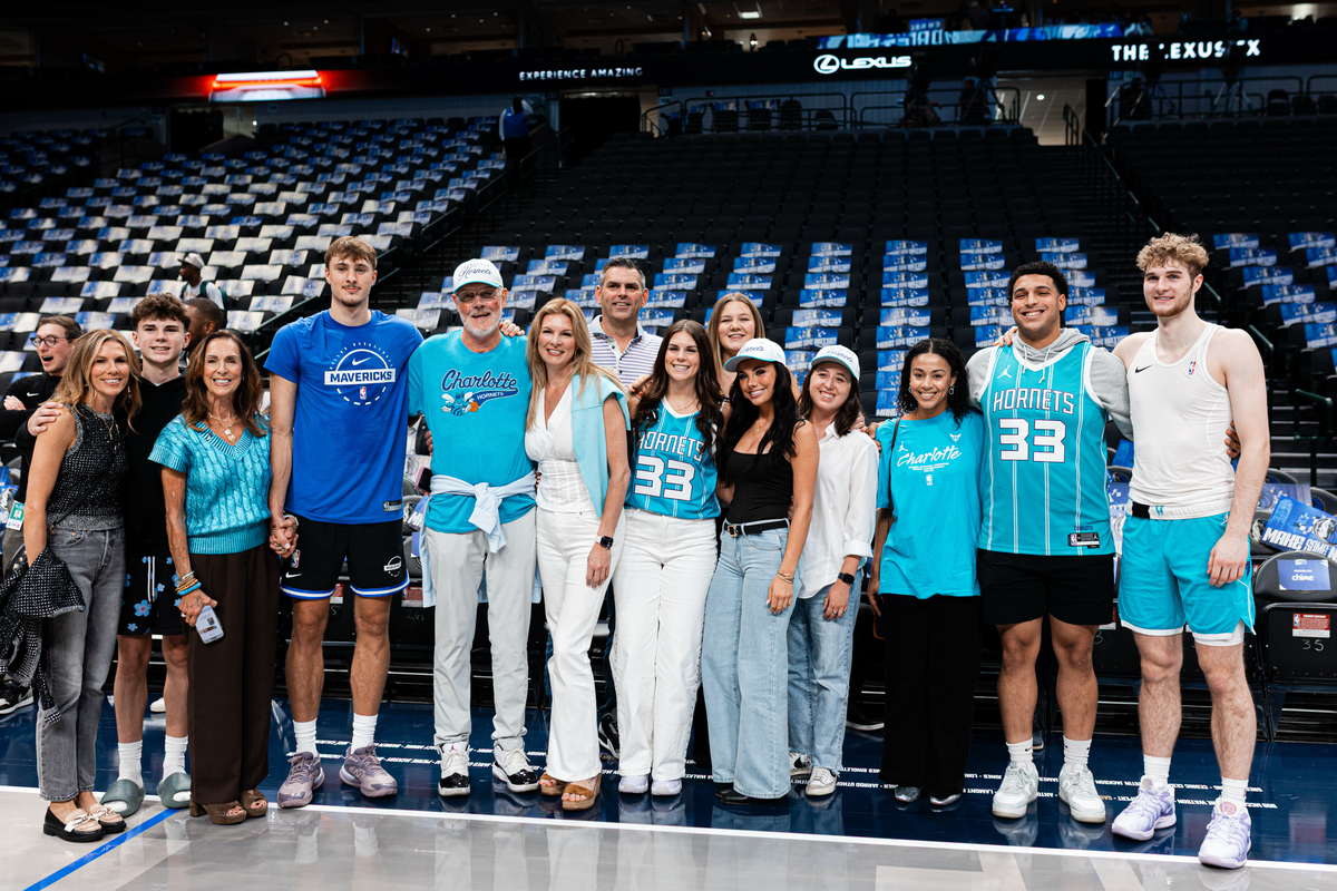 Charlotte Hornets forward Liam McNeeley (right) poses with friends and family before Saturday’s preseason game at American Airlines Center.