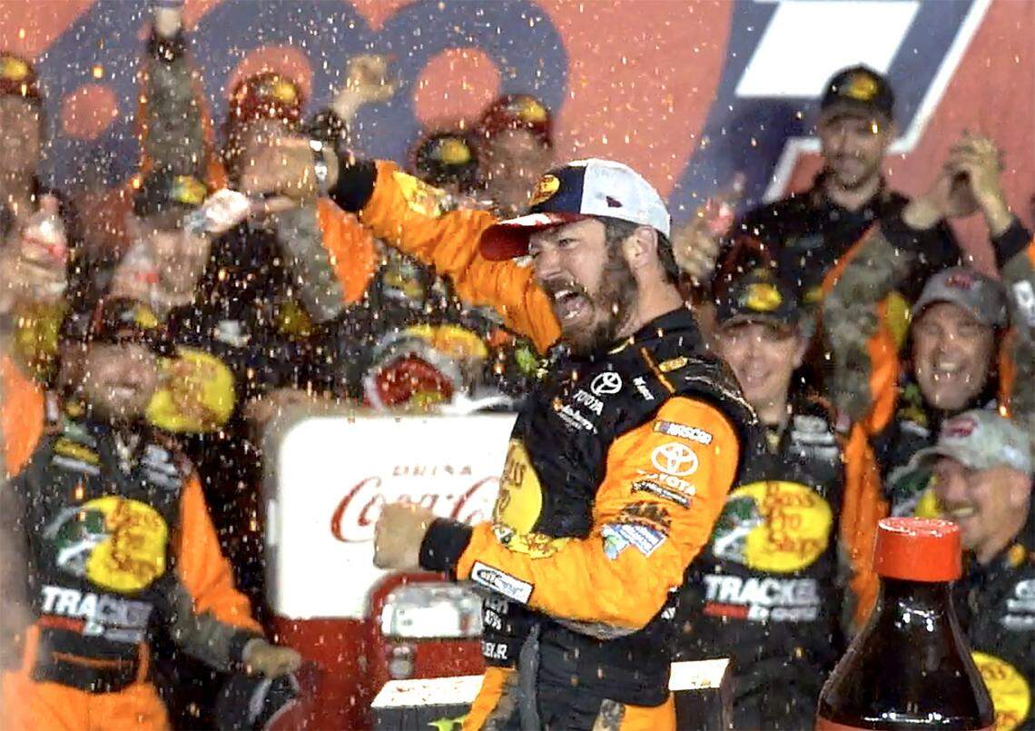 NASCAR driver Martin Truex Jr. celebrates winning the Coca-Cola 600 at Charlotte Motor Speedway in Concord, NC on Sunday, May 26, 2019.