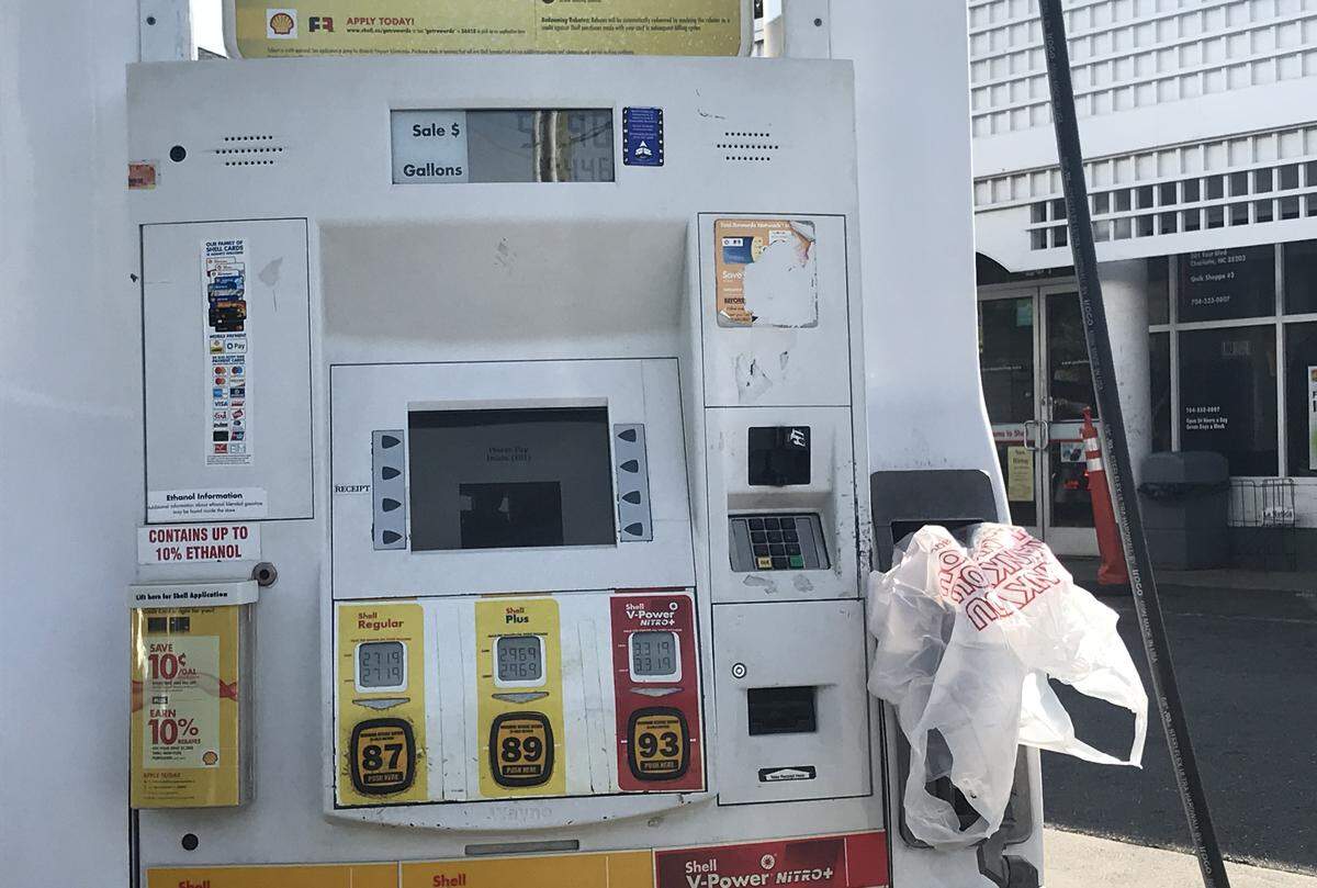 The Shell gas station at East and South boulevards in Charlotte had bags covering some pumps Tuesday morning.