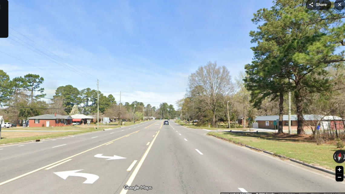 Woman drove for miles with a man clinging to hood of car, NC sheriff says