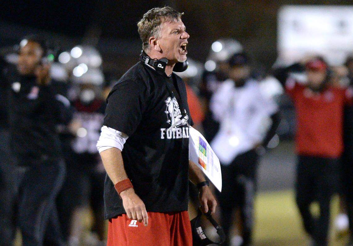 Butler Bulldogs head coach Brian Hales disagrees with an official’s call during first half action against Hickory Ridge at Butler High School on Friday, November 4, 2022.