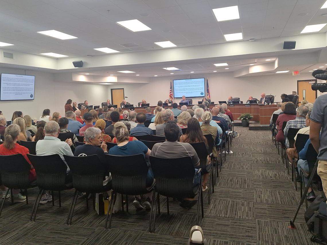 A standing room-only crowd of about 200 neighbors Monday night, Aug. 4, 2025, opposing plans by the widow of NASCAR legend Dale Earnhardt for a $30 billion data center on 399 of her rural east Mooresville acres.