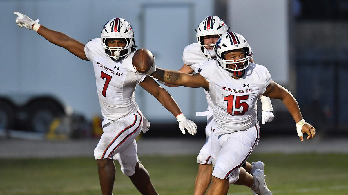 Providence Day defensive lineman Jace Goodwin (15) celebrates with teammates after recovering a fumble by Rolesville in the first half. The Rolesville Rams and the Providence Day Chargers met in a non-conference football game in Rolesville, N.C. on August 29, 2025.