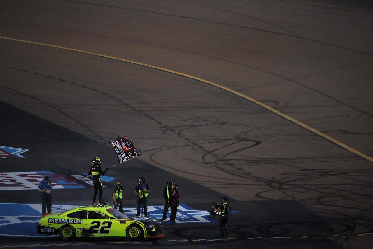 AVONDALE, ARIZONA - NOVEMBER 07: Austin Cindric, driver of the #22 Menards/Richmond Ford, celebrates after winning the NASCAR Xfinity Series Desert Diamond Casino West Valley 200 and the 2020 NASCAR Xfinity Series Championship at Phoenix Raceway on November 07, 2020 in Avondale, Arizona. (Photo by Christian Petersen/Getty Images)