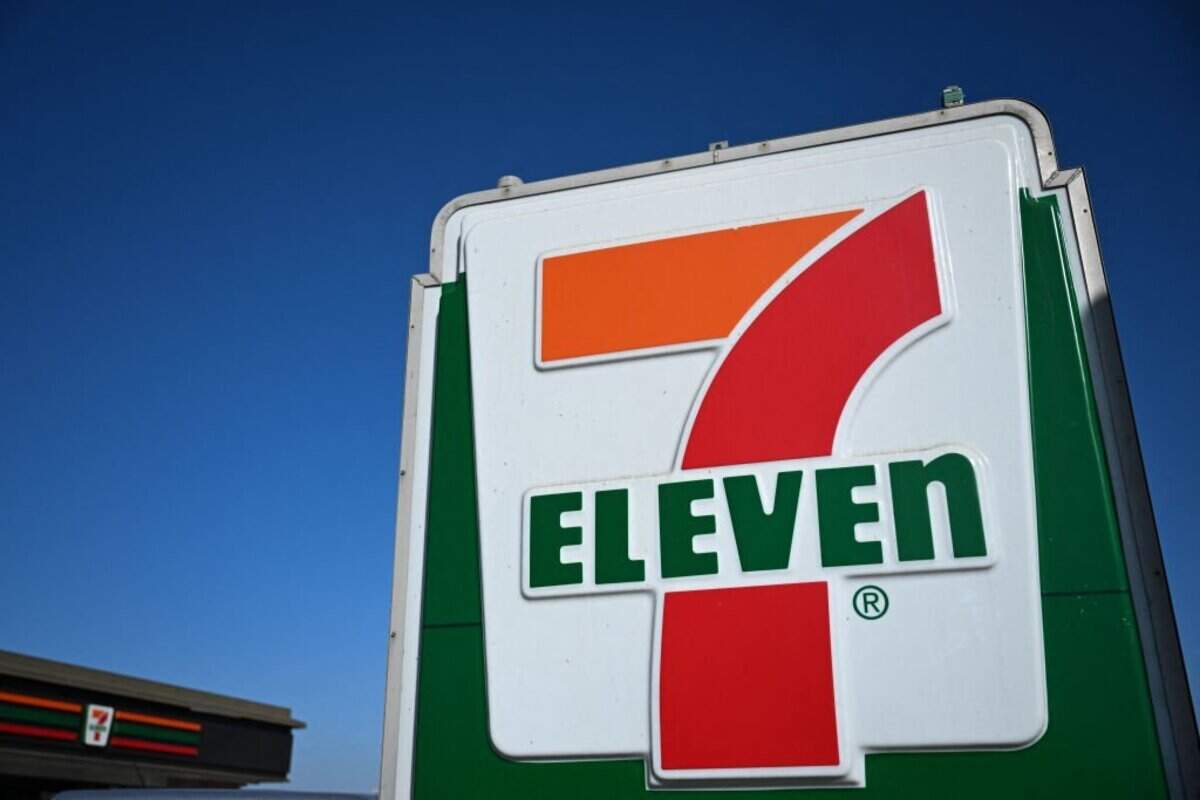 The 7-Eleven logo is displayed on a sign outside of a convenience store in Torrance, California on October 14, 2024. 7-Eleven announced a major restructuring on October 10, 2024 as it seeks to boost its share price and fend off what would be the biggest foreign takeover of a Japanese firm. Seven & i Holdings rejected a $40-billion takeover bid last month from Alimentation Couche-Tard (ACT) but the Canadian group has since then reportedly sweetened its offer. The company's CEO reported in an earnings call on October 10, 2024 held by Tokyo-based parent company Seven & I Holdings that it's shuttering 444 "underperforming" locations, citing inflation pressures, slowed traffic, a decline in cigarette sales and a shift in consumer appetites. The closures amount to 3% of the chain's total of more than 13,000 stores in the US and Canada. (Photo by Patrick T. Fallon / AFP) (Photo by PATRICK T. FALLON/AFP via Getty Images)