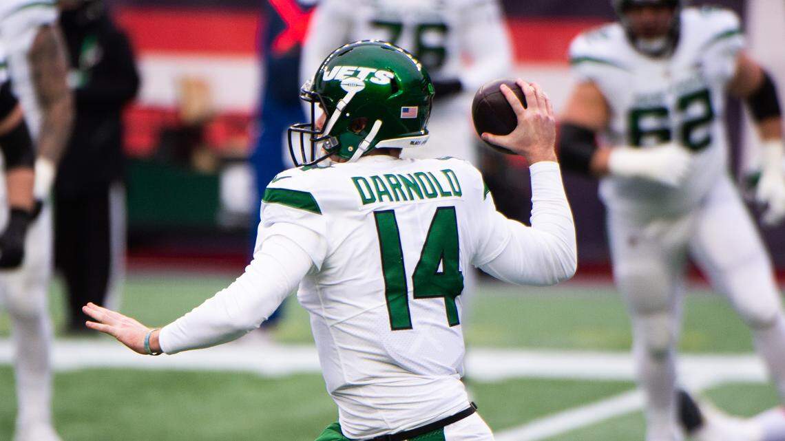 Sam Darnold #14 of the New York Jets makes a pass against the New England Patriots in the first half at Gillette Stadium on January 3, 2021, in Foxborough, Mass. (Kathryn Riley/Getty Images/TNS)