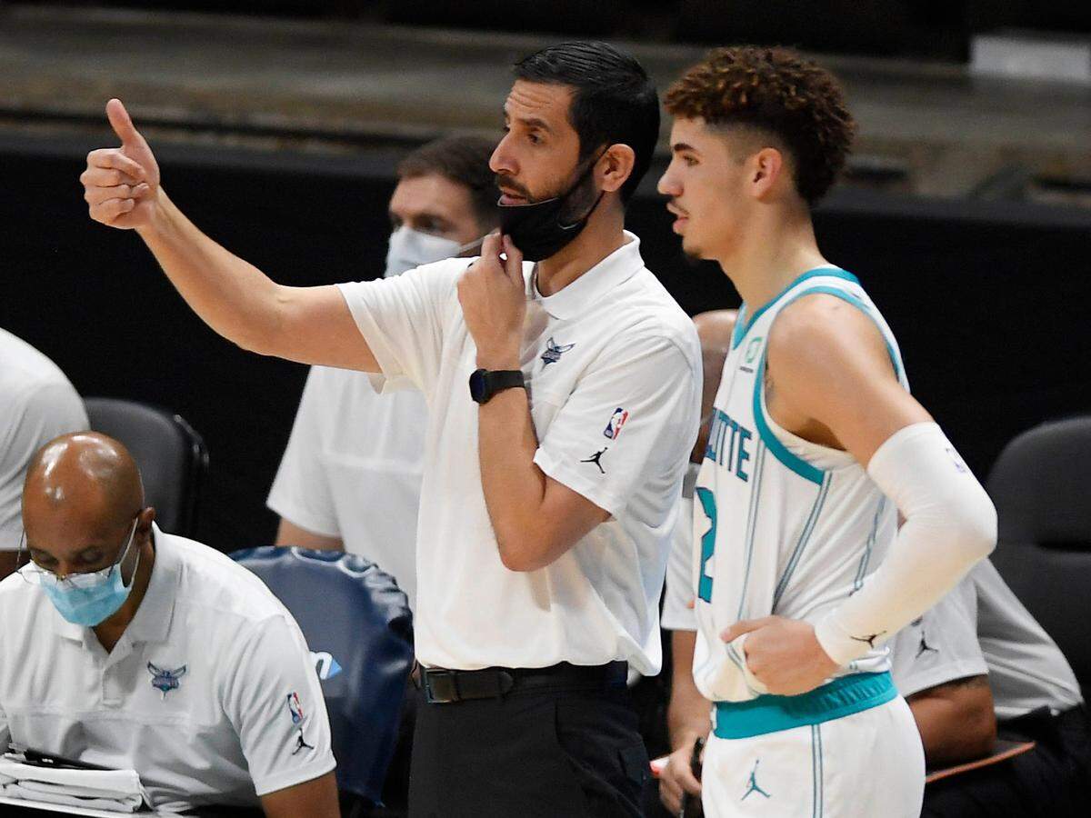 Charlotte Hornets head coach James Borrego talks with guard LaMelo Ball during a preseason game against the Toronto Raptors Spectrum Center on Dec. 14. Borrego respects Ball’s love for family, which the rookie said is his No. 1 priority in life.