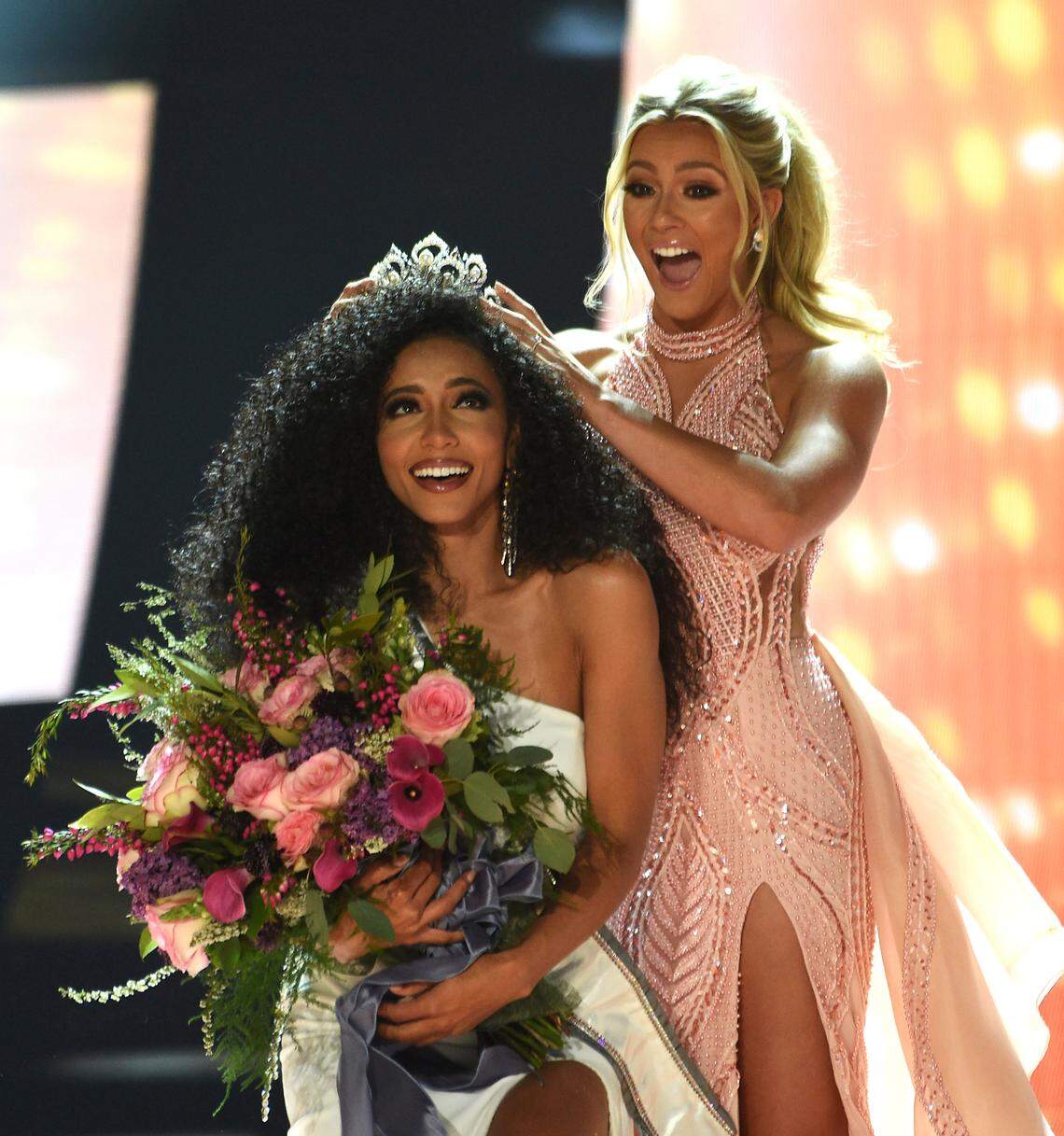 Miss USA Sarah Rose Summers, right, crowns her successor, Miss North Carolina Cheslie Kryst, at the 2019 Miss USA final competition in Reno, Nev., on May 2, 2019. Kryst, a correspondent for the entertainment news program “Extra,” has died. She was 30 years old.