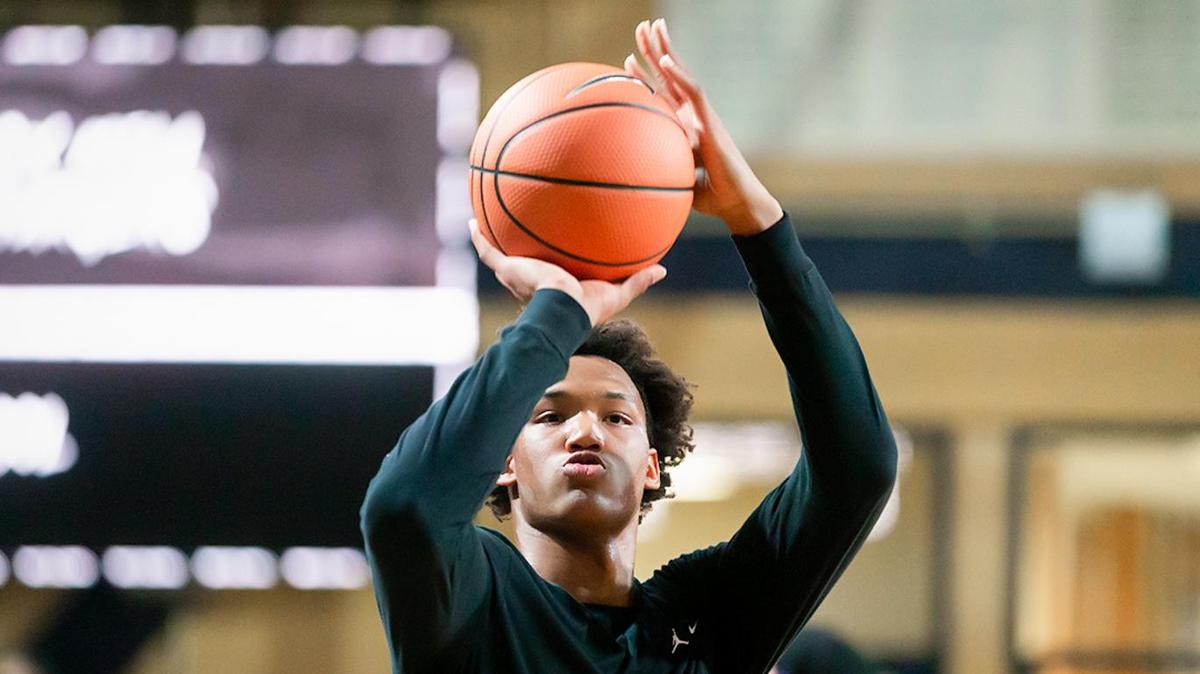 Cox Mill’s Wendell Moore run through pre-game activities at the Own The Game Invitational at JC Smith Thursday.
