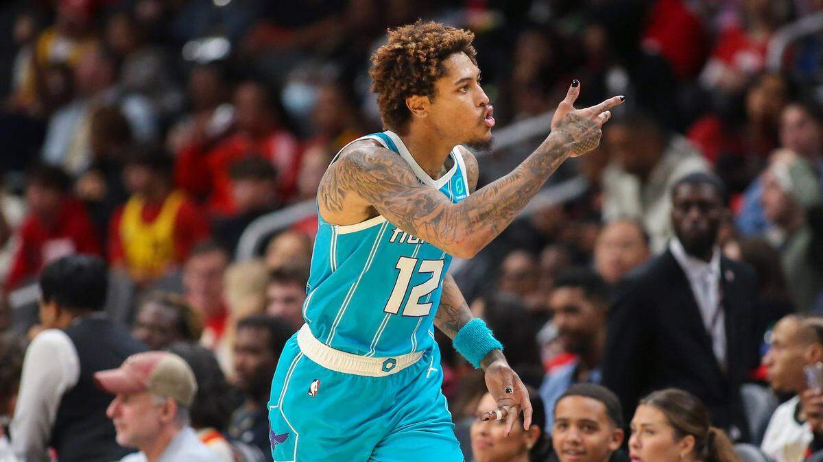 Charlotte Hornets guard Kelly Oubre Jr. (12) reacts after a three-pointer in the second half of a NBA basketball game against the Atlanta Hawks Sunday, Oct. 23, 2022 in Atlanta. (AP Photo/Brett Davis)