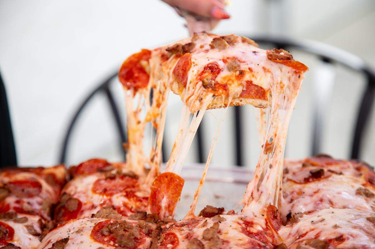 The Hawthorne’s Pepperoni & Sausage Sicilian Pizza has a square, thick crust and is topped with pizza sauce, pepperoni, Italian sausage and mozzarella cheese.