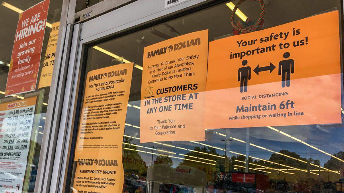 Social distancing guidelines and notices are posted at the front door of the Family Dollar store on South Boulevard on Tuesday, May 12, 2020.