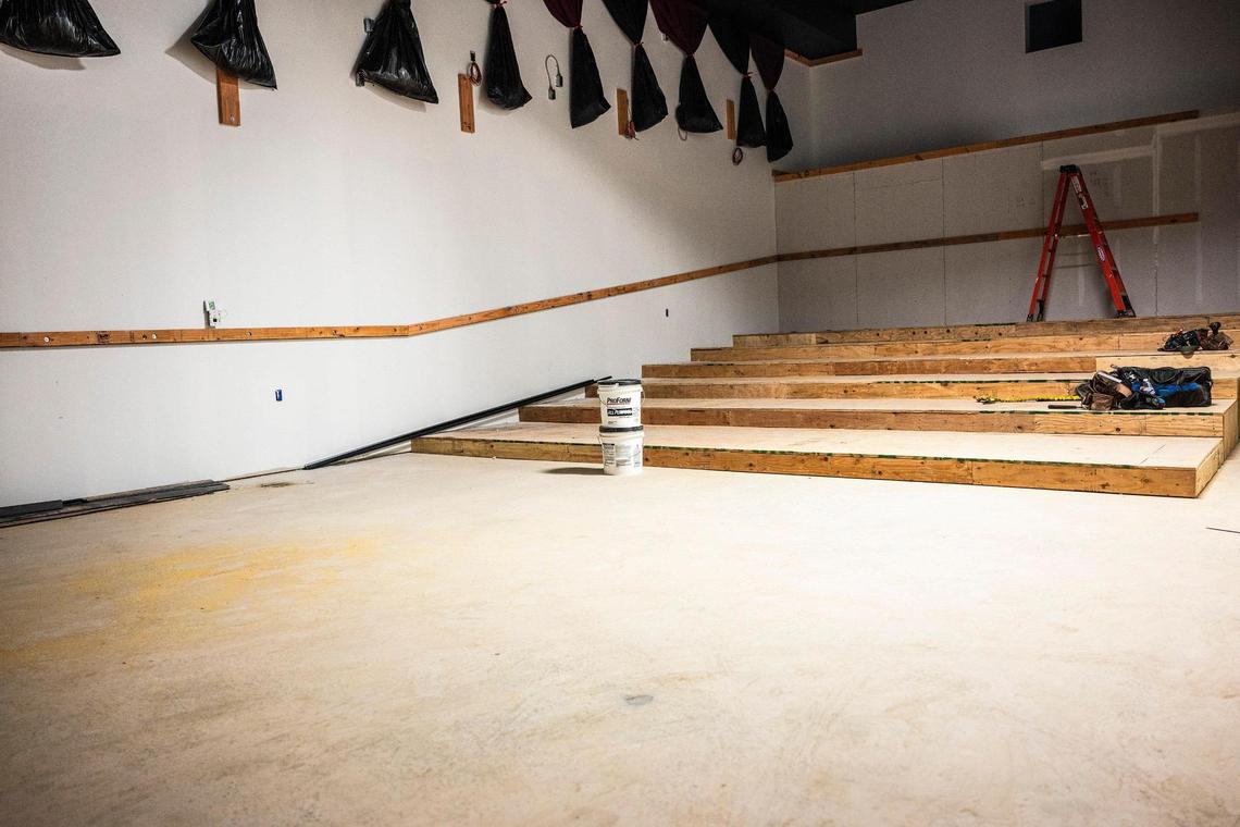 The skeleton of one of the auditoriums Charlotte Film Society’s Independent Picture House on Tuesday, March 22, shows risers and curtains installed. One of three screens, theater one will seat 77 in rocker-style chairs.