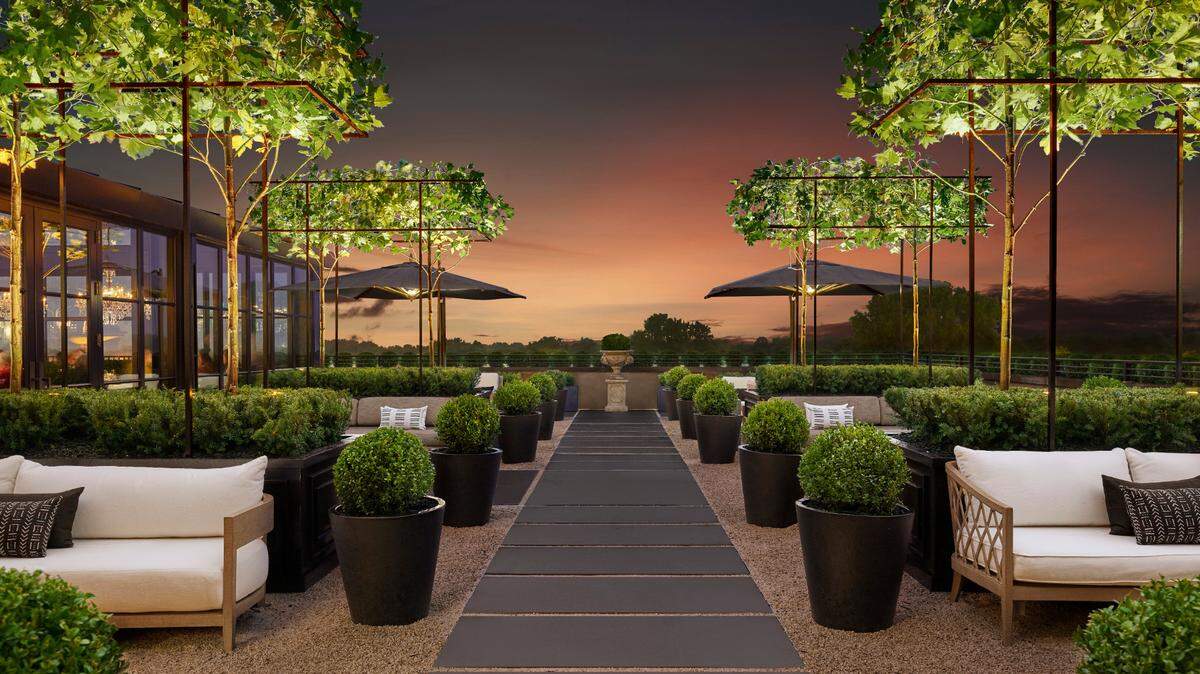 Order a glass of wine to enjoy on the rooftop at RH Charlotte.