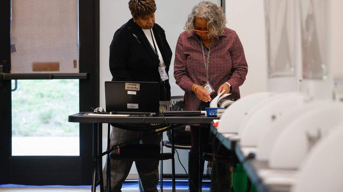 Caleb Theodros faces a challenge to his Election Day victory in Senate District 41. Second-place finisher Lucille Puckett says Theodros hasn’t lived in the district long enough. In this file photo, election official Kay Patterson, left, looks through paperwork with site coordinator Frankie Jenkins at Eastway Regional Recreational Center in Charlotte.