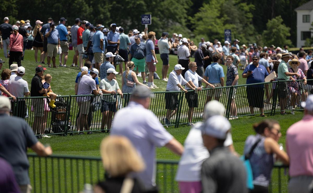 Fan watch players on the 17th hole during the second practice day at the 107th PGA Championship at Quail Hollow in Charlotte, N.C., on Wednesday, May 14, 2025.