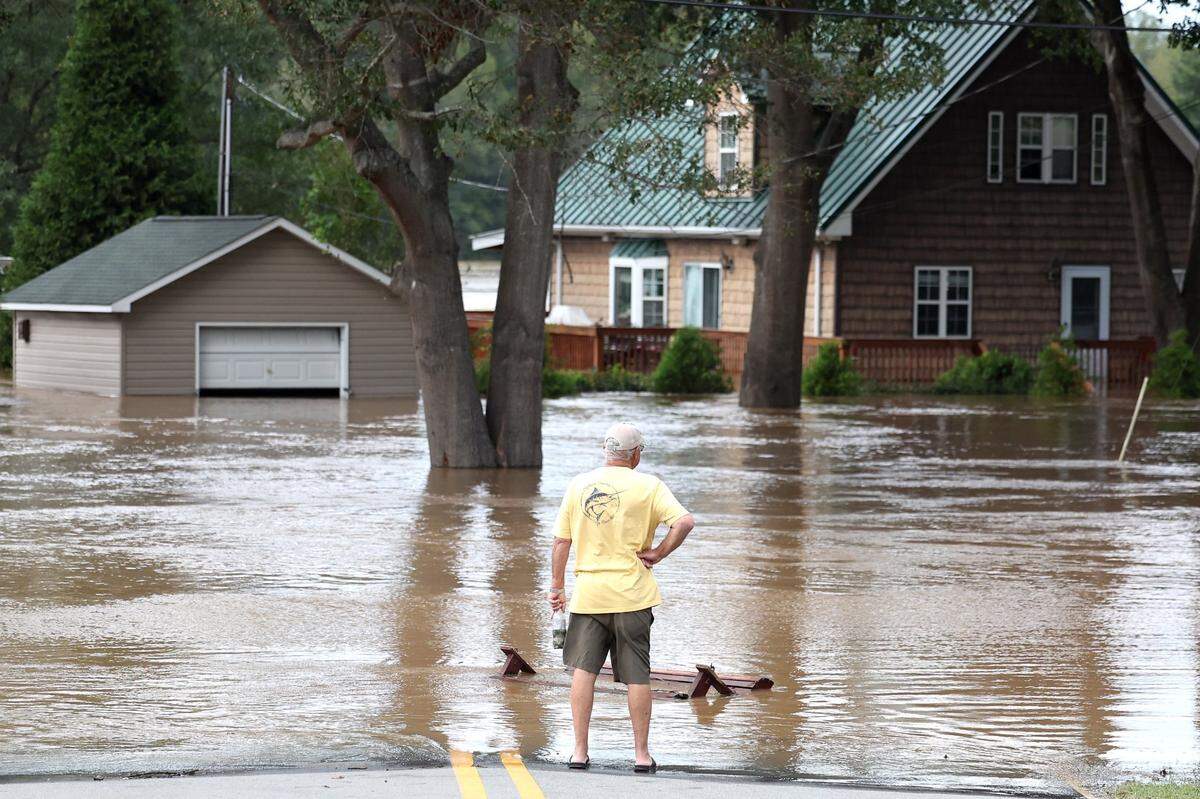 A resident stands at the end of Hart Rd. and Riverhaven Drive near Mountain Island Lake on Saturday, September 28, 2024.