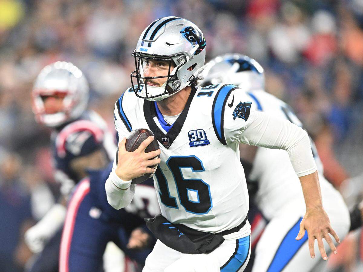 Carolina Panthers quarterback Jack Plummer (16) runs with the ball against the New England Patriots during the second half at Gillette Stadium.