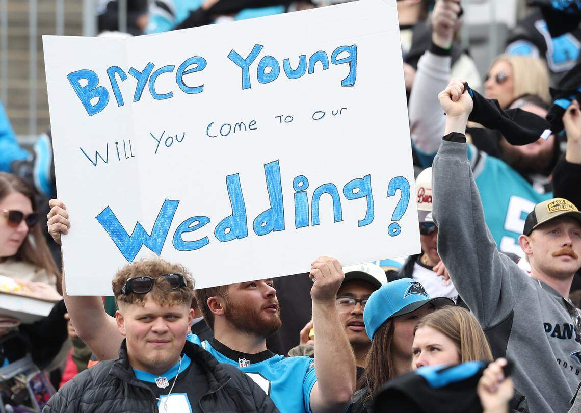 A Carolina Panthers fan makes a plea to quarterback Bryce Young during the team's game against the Tampa Bay Buccaneers on Sunday, December 21, 2025 at Bank of America Stadium in Charlotte, NC. The Panthers defeated the Buccaneers 23-20.