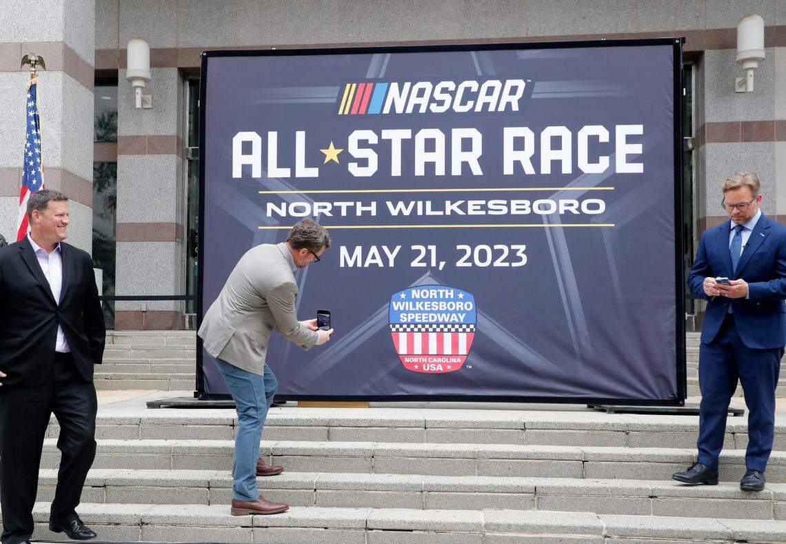 Dale Earnhardt Jr. takes a photo after a press conference announcing that the NASCAR All-Star Race will be held at North Wilkesboro Speedway in May 2023. The press conference was held on the steps of the N.C. Museum of History in Raleigh, N.C., Thursday, Sept. 8, 2022.