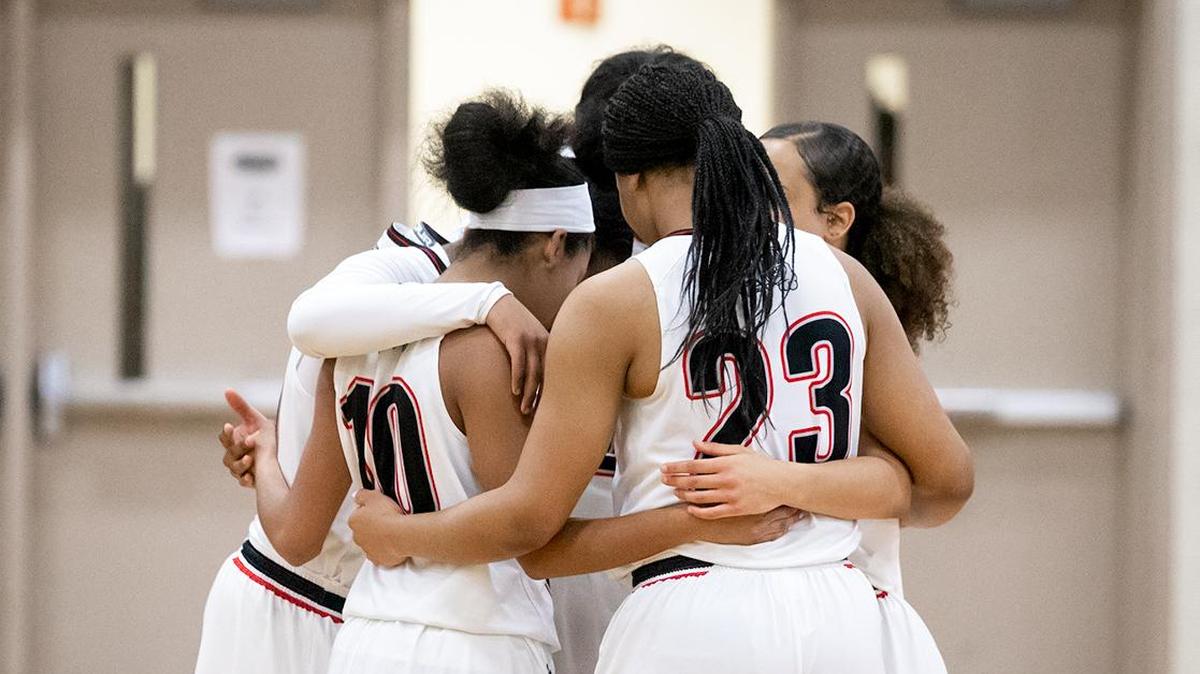 The Lady Bulldogs get ready for the tipoff against Myers Park.