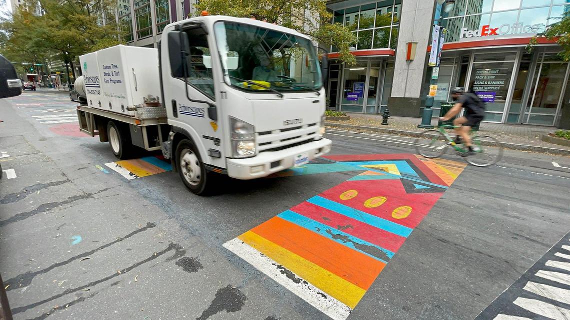 Motorists and cyclists roll over the Black Lives Matter mural painted on the 200-block of South Tryon Street on Tuesday, Nov. 10.