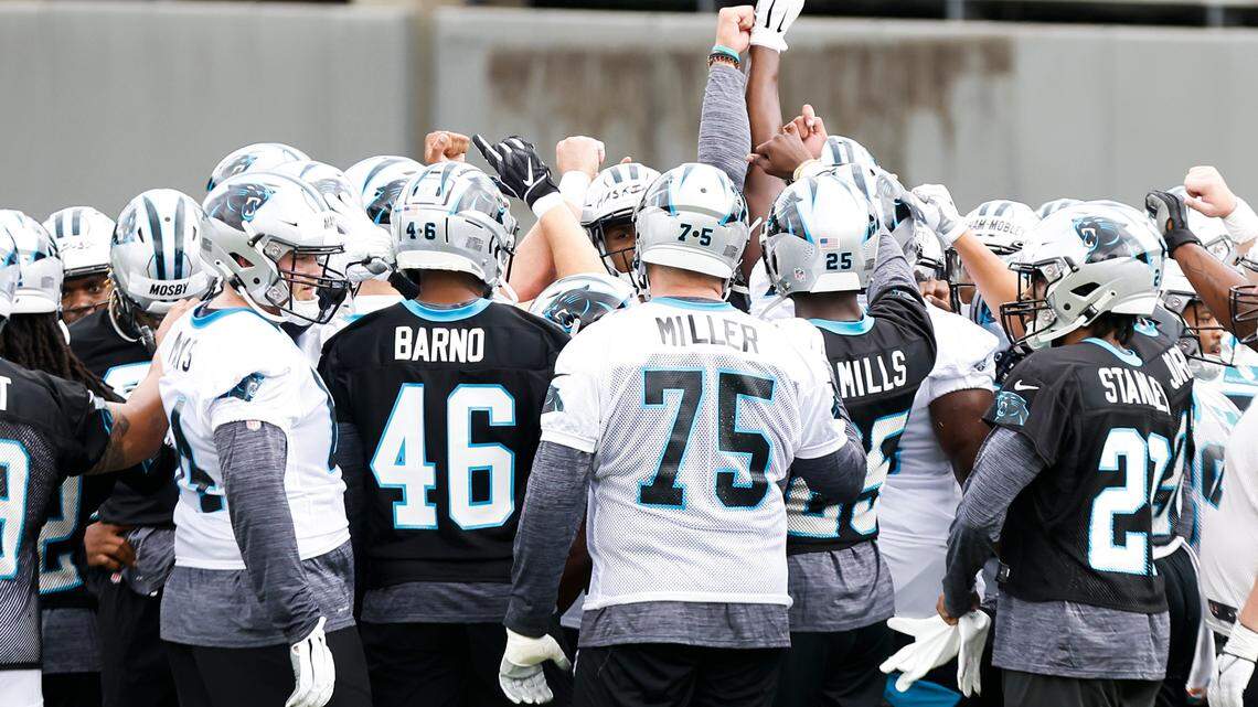 The Carolina Panthers huddle on the field during rookie minicamp at the Panthers practice field in Charlotte, N.C., Friday, May 13, 2022.