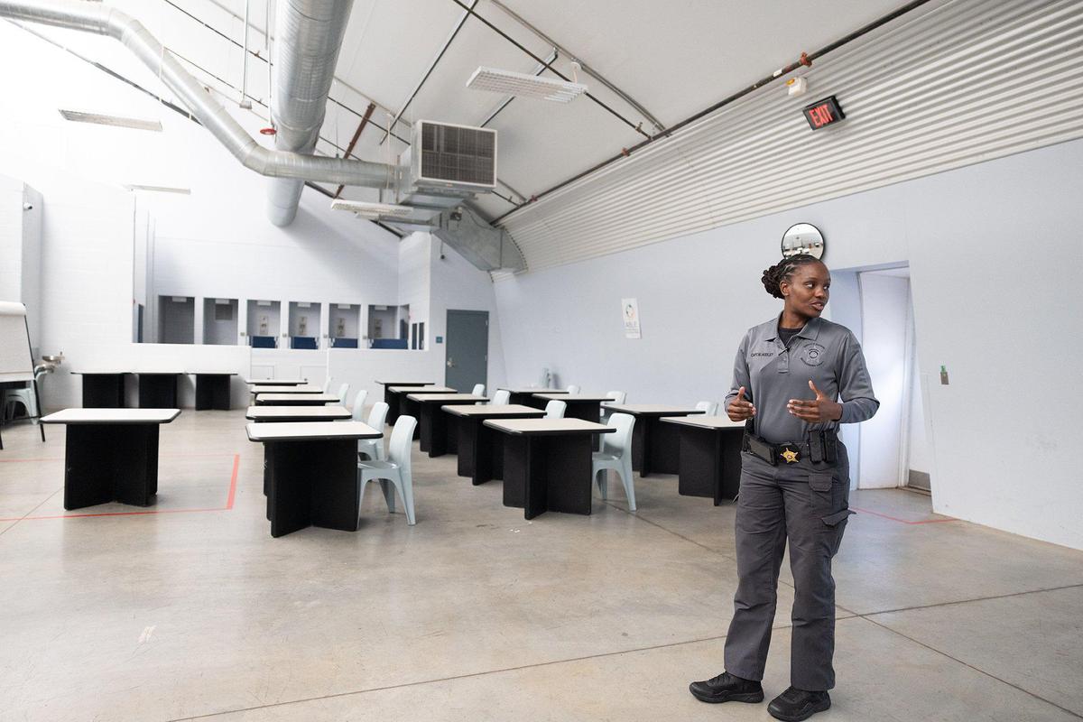 Capt. Marissa Hudley, head of training at Mecklenburg County Sheriffs Office, stands in a room in the old jail annex previously used to hold inmates is used that is used as a classroom room the Mecklenburg County Sheriffs Office Training Academy in Charlotte, N.C., on Thursday, June 8, 2023.