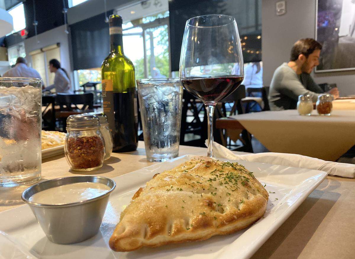 Enjoy a calzone with a glass of wine from Omaggio after a Target haul.