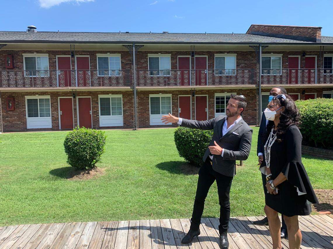 Travis Steffens, President and CEO of R. Investments, shows Denise Cleveland-Leggett of the U.S. Department of Housing and Urban Development, right, and Ashley Bell, back, of the Small Business Administration, plans to renovate Independence Place, a long-stay hotel in east Charlotte. The development will use a tax break through the Trump Administration’s Opportunity Zones program aimed at spurring development in areas of disinvestment. Representatives from Washington were in Charlotte on Sept. 3, 2020, to tour the project.