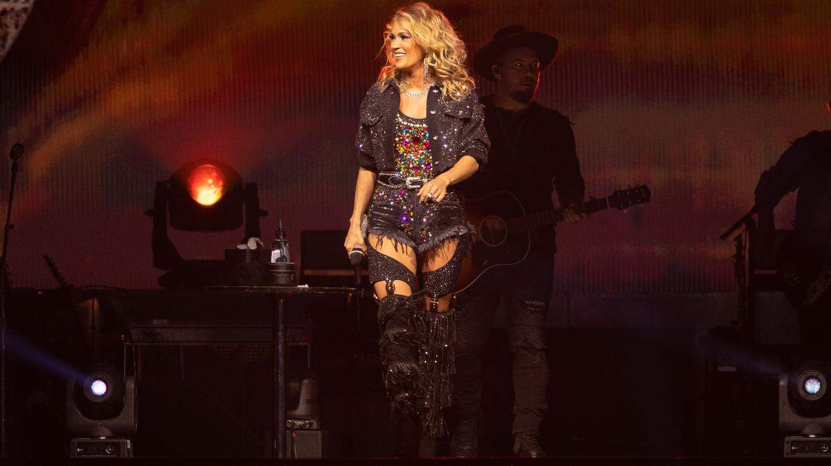 Carrie Underwood smiles to the crowd between songs at Spectrum Center in Charlotte on Wednesday night.