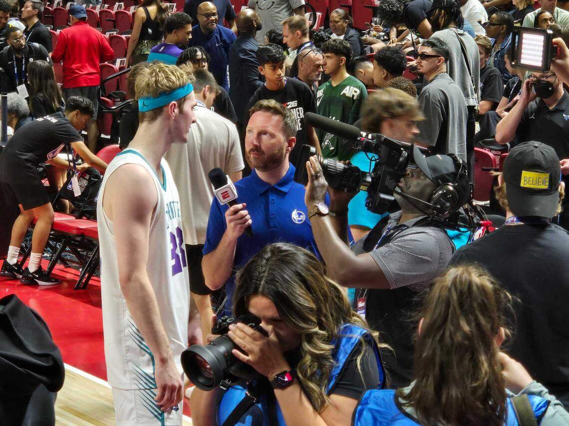 Charlotte Hornets rookie Liam McNeeley conducts a postgame TV interview after first game in Las Vegas Summer League.