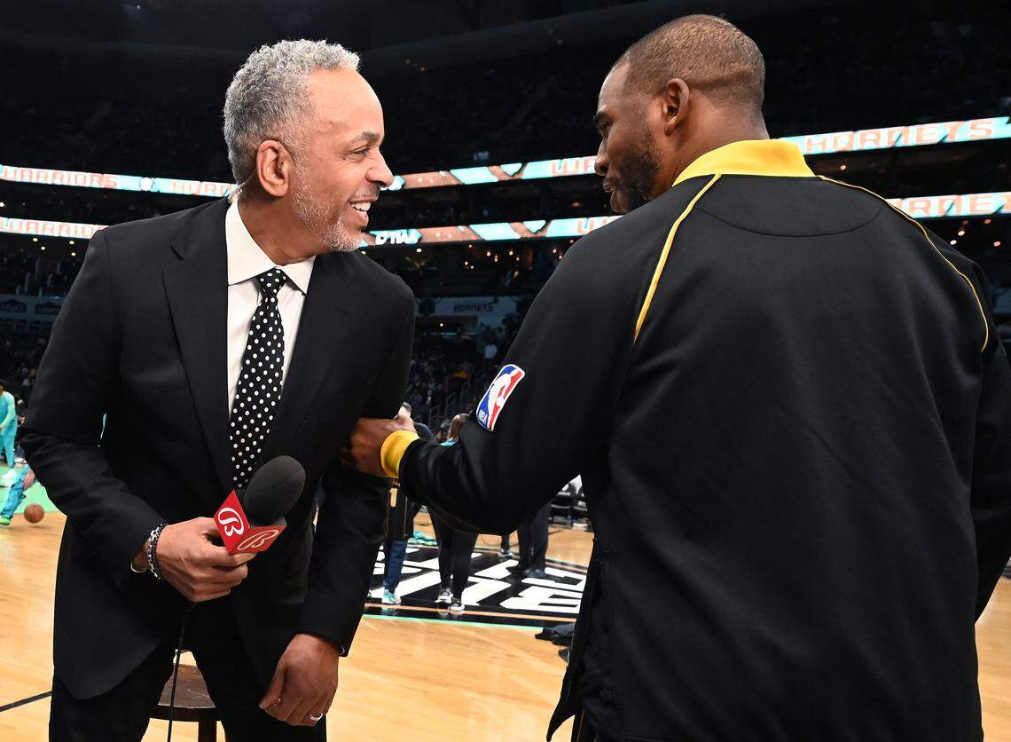 Former Charlotte Hornets guard Dell Curry, left, joke with Golden State Warriors guard Chris Paul prior to the team’s March 29, 2024 game against the Charlotte Hornets at Spectrum Center.