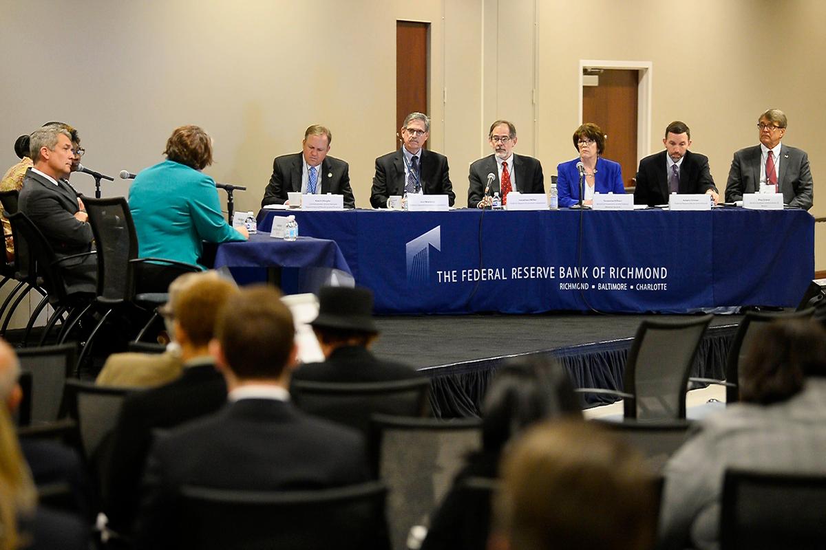 When SunTrust and BB&T merged, they kept an unusual set of regulators for a bank as big as it would be. Members of the Federal Reserve and FDIC, two of the regulators, listen to comments on the planned merger of BB&T and SunTrust during a public hearing in 2019.