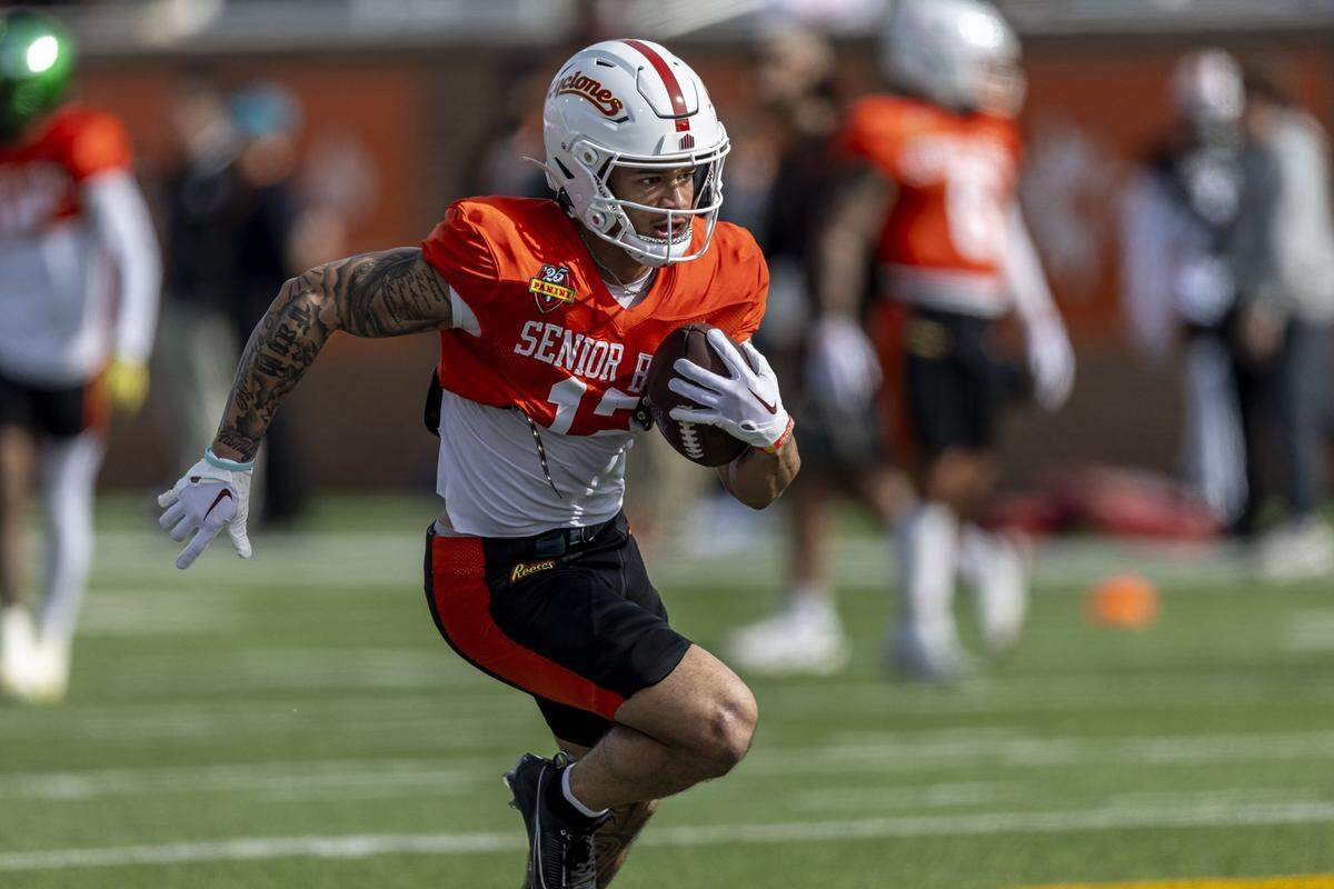 Jan 28, 2025; Mobile, AL, USA; National team wide receiver Jaylin Noel of Iowa State (12) runs a play during Senior Bowl practice for the National team at Hancock Whitney Stadium. Mandatory Credit: Vasha Hunt-Imagn Images