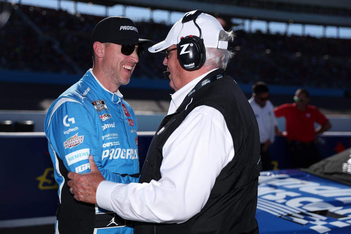 Cup Series driver and 23XI co-owner Denny Hamlin and NASCAR Hall of Famer and Hendrick Motorsports team owner Rick Hendrick talk on the grid during qualifying for the NASCAR Cup Series Championship on Nov. 1, 2025, at Phoenix Raceway.