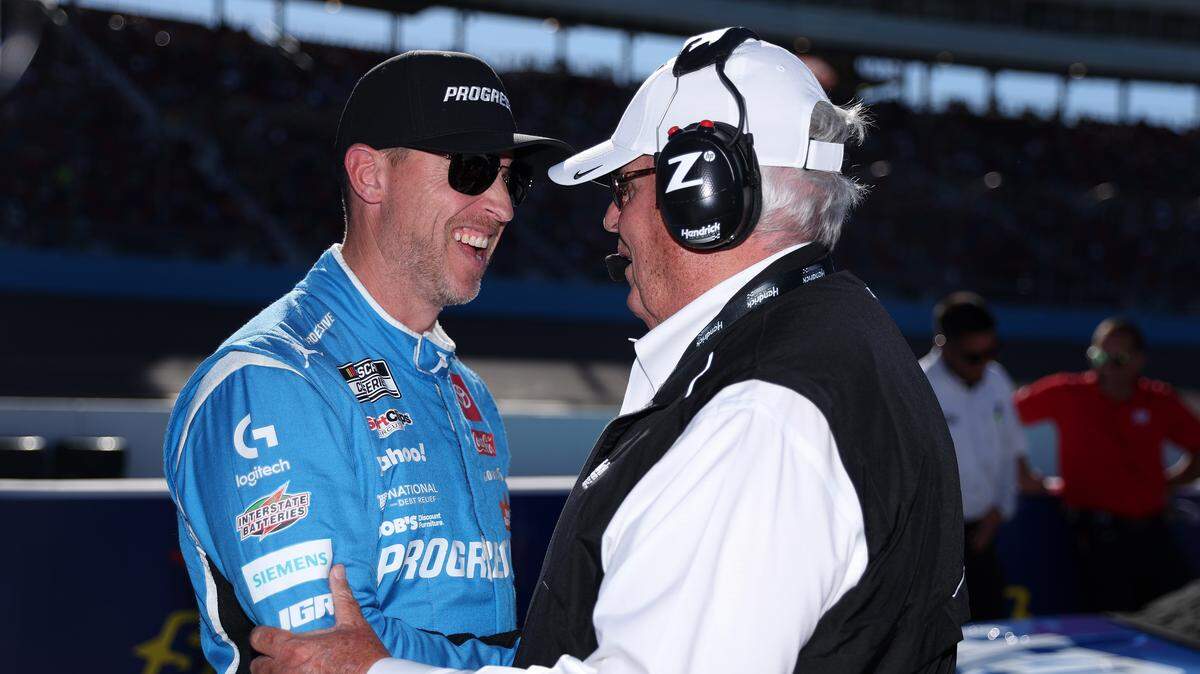 Cup Series driver and 23XI co-owner Denny Hamlin and NASCAR Hall of Famer and Hendrick Motorsports team owner Rick Hendrick talk on the grid during qualifying for the NASCAR Cup Series Championship on Nov. 1, 2025, at Phoenix Raceway.