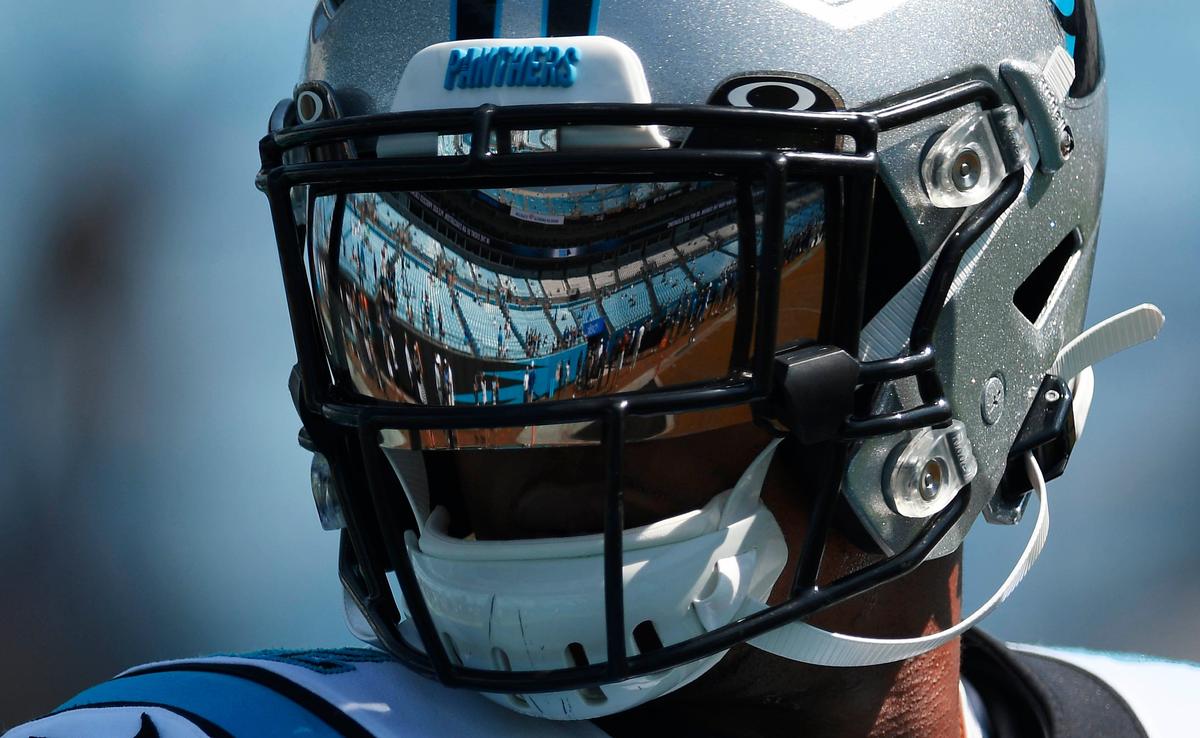 The seats at Bank of America Stadium are reflected in the visor of Panthers wide receiver DJ Moore prior to the season opener in September against the L.A. Rams.