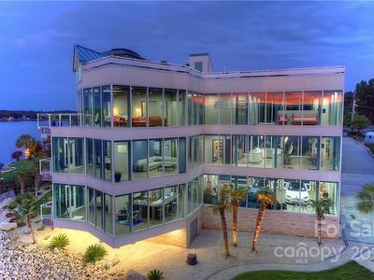 Ted and Beverly Corriher’s three-story, all-glass Lake Norman mansion is for sale for nearly $5.5 million.